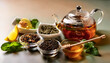 © Konstantin Sigaev - A glass teapot with herbal tea is surrounded by loose leaf tea varieties, honey, lemon, and mint leaves, creating a warm and inviting atmosphere.