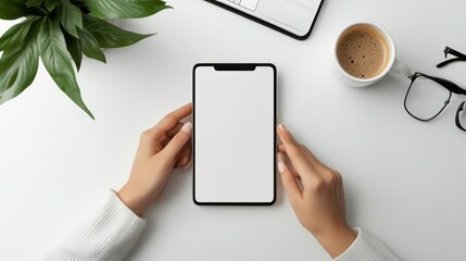 Poster - Hands holding smartphone with blank screen on white table with coffee, glasses, and plant.