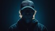 © upnowgraphics - Portrait of a Young Man in a Black Baseball Cap and Hoodie, Lit from Behind