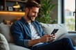 © Pete - Man sits comfortably on a sofa using a mobile phone for social media marketing. He looks happy and focused. Indoor shot of a home office environment. Relaxed and productive lifestyle.