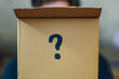 © Ram - Cardboard box with a question mark symbolizing curiosity, mystery, and surprise. Perfect for concepts like unboxing, hidden ideas, or surprise packages in creative projects