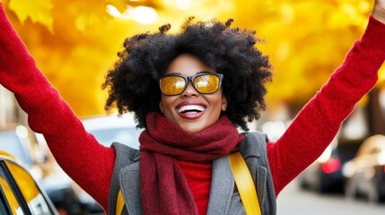 Wall Mural - An excited female tourist was driving alone,  enjoying the freedom of a road trip.  A woman's joy and freedom in autumn shows her love for life and her anticipation  for new adventures.