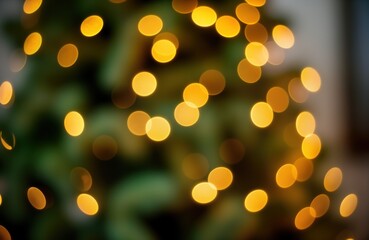 Aufkleber - Blurred christmas tree lights create abstract festive bokeh. Golden, yellow lights shine brightly on dark green background. Holiday abstract photo shows glowing lights. Great for christmas design new