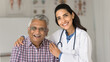 © fizkes - Portrait of happy older man and nurse posing for camera. Caring friendly medical worker wear white coat hugs senior male patient at his visit in clinic. Eldercare, medicine, insurance cover for elders