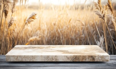 Aufkleber - A marble slab on a wooden surface with a blurred golden field in the background.
