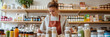 © VERTEX SPACE - A young woman in an apron is focused on her tablet while surrounded by various jars and bottles of herbs and supplements in cozy shop. atmosphere is warm and inviting, perfect for exploring natural pr