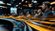 © Natalia - Modern conference room with blurred audience and dynamic light trails representing technology and innovation. Focus on a young man attending a seminar in a dark setting.