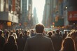 © Imagentive - Man in Suit Walks Through City Crowd with Sun Glare