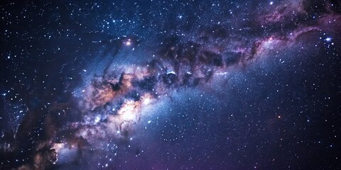 Wall Mural - the camera captures a vast expanse of dark blues and purples, punctuated by tiny stars and galaxies 