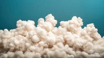 Canvas Print - Abstract representation of billowy cloud formations against a clear blue sky, showcasing a soft, fluffy texture and a serene atmosphere.