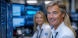 © sommersby - Two traders focus on their work in a dynamic financial office, surrounded by screens that show various market charts and data analysis