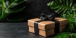 © N0X - Eco-friendly e-commerce concept. A beautifully wrapped gift box with a black ribbon sits amidst lush green foliage, creating an inviting and festive atmosphere.