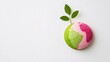 © Rama - Round sticker of earth in green and pink with a small sprouting leaf, placed on a white background, symbolizing a promise for a greener future