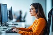 © Denis Tuev - A woman with disabilities communicates with employees in the office, taking notes on a computer, side view