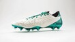 © ThatWorksMedia - White and teal soccer cleats isolated on white background. Dynamic sports footwear for enhanced performance and agility on the field. Step into victory.