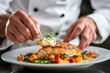 © bramthestocker - Close-up of a chef preparing a gourmet dish with precision and finesse