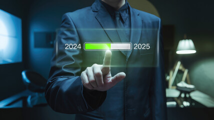 A man in a suit is pressing a button on a screen that displays the years 2024 and 2025. Concept of progress and advancement, as the man is actively engaging with the technology
