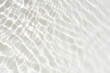 © Water 💧 Shining 📸 - White water with ripples on the surface. Defocus blurred transparent white colored clear calm water surface texture with splashes and bubbles. Water waves with shining pattern texture background.