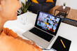 © Xavier Lorenzo - Rear view of senior businesswoman having a video call with business colleagues while working on laptop from home office. Teamwork and businesspeople concept