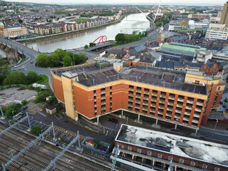 Wall Mural - High Angle View of Newport City on River Usk Wales, United Kingdom During Sunset. Aerial Footage Was Captured with Drone's Camera on May 27th, 2024