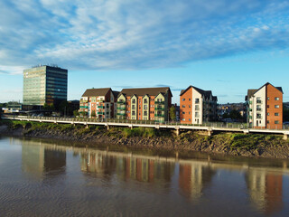 Wall Mural - High Angle View of Newport City on River Usk Wales, United Kingdom During Sunset. Aerial Footage Was Captured with Drone's Camera on May 27th, 2024