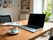 © Pablo - laptop sobre escritorrio de trabajo, con libreta y taza de cafe, en entorno de ofina acojedor.