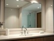 © somsak - A clean bathroom with a large mirror reflecting the shining faucet and tidy surroundings, organized, reflection