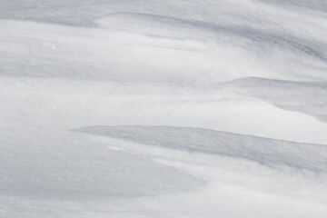 Wall Mural - close up of edge of white snowdrift surface abstract texture background