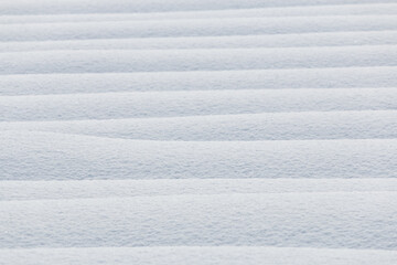 Wall Mural - abstract textured background of horizontal lines of pure white fresh snow in winter, japan