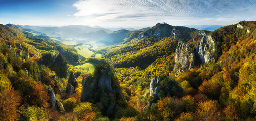 Poster - Colorful forest at sunset in autumn. Top view of mountain in woods. Beautiful landscape with  red and orange leaves in fall. Slovakia - Sulov