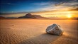 © vilavanh - A single gray rock sits alone in the desert landscape at sunset, arid environment, desert landscape, sunset, geological formation