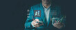 © chiew - Businessman Using AI technology with business operations, automation systems to help make money, Financial artificial intelligence, Fintech, Cryptocurrency, and Cashless payment