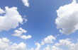 © ChiccoDodiFC - clouds on a blue sky and a space in the center to insert a photo or a personalized text among the clouds