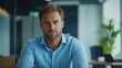 © Erich - Portrait of confident businessman sitting in modern office