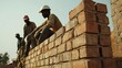 © Kitta Studio - Builders Working on Brick Wall Construction