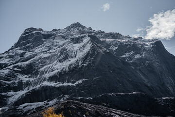 Close up Four Girls Mountain in Aba prefecture Chengdu city Sichuan province, China.Siguniang mountain or Four sister mountain with snow cap on top and colourful autumn in Sichuan, China