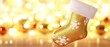 © Nathamanee - A gold and white Christmas stocking with snowflakes on it