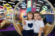 © Studio Peace - Happy and cheerful children, a boy and a girl, in a modern playroom.