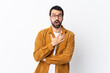 © luismolinero - Caucasian handsome man with beard wearing a corduroy jacket over isolated white background surprised and shocked while looking right