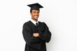 © luismolinero - African American university graduate man over isolated white background with arms crossed and looking forward