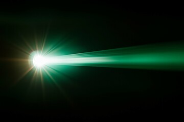 Wall Mural - a green bokeh flare light effect on a black background, suitable for overlays and screens