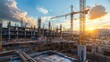 © Phatharaporn - A vibrant construction site at sunset, featuring cranes and structures, illustrating the dynamic nature of urban development.