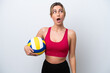 © luismolinero - Young caucasian woman playing volleyball isolated on white background looking up and with surprised expression