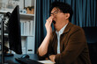 © Summit Art Creations - Working businessman feeling extremely sleepy with yawning while working on desk with unfinish project at workplace, planing online business using information project at over late night time. Infobahn.
