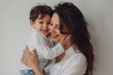 Poster - A mother holds a young child in her arms, with a loving expression