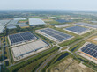 © Sepia100 - Aerial drone picture of modern distribution center in Venlo, The Netherlands. Solar panels on the roof, large warehouses.