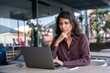 © Stock 4 You - Focused young professional it specialist latin hispanic business working on laptop pc sitting at desk in modern office. Middle eastern indian woman using computer technology app for work. Copy space