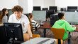 © JackF - Portrait of interested teenage student during lesson in computer room of school library ..
