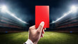 © Diamon jewelry - Hand with a red card in a football arena