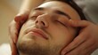 © milenialdesastudio - Close-up of a man receiving a relaxing facial massage.